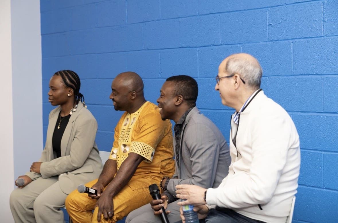 The panellists seated in front of the audience during the discussion