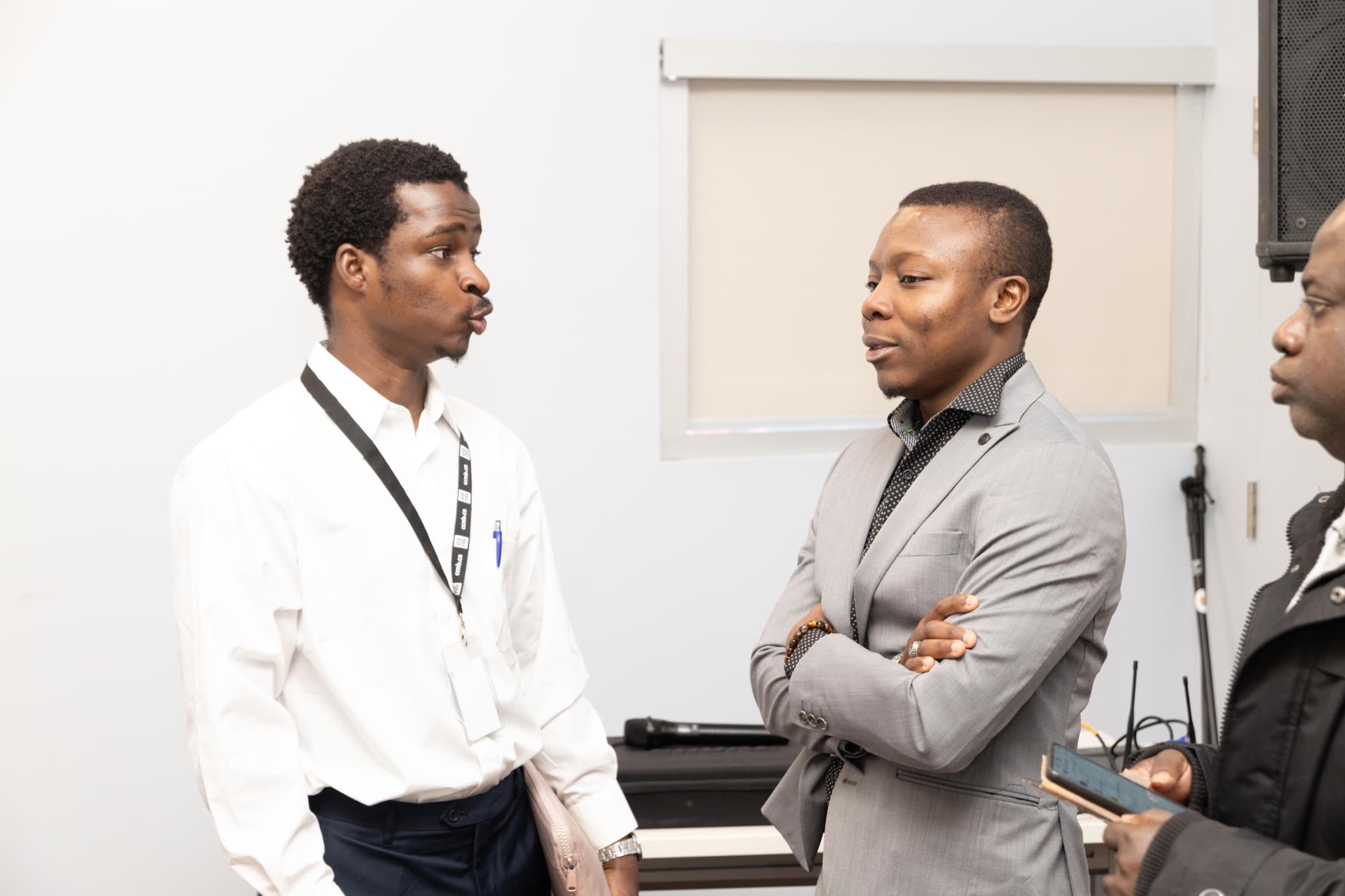 A young participant talks with a speaker during a COPAJE AF/CA talk